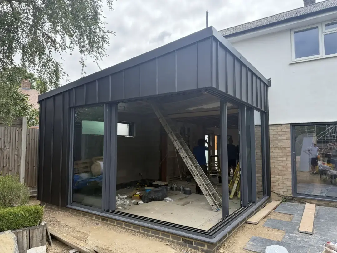 Black standing seam zinc clad garden room extension in Putney