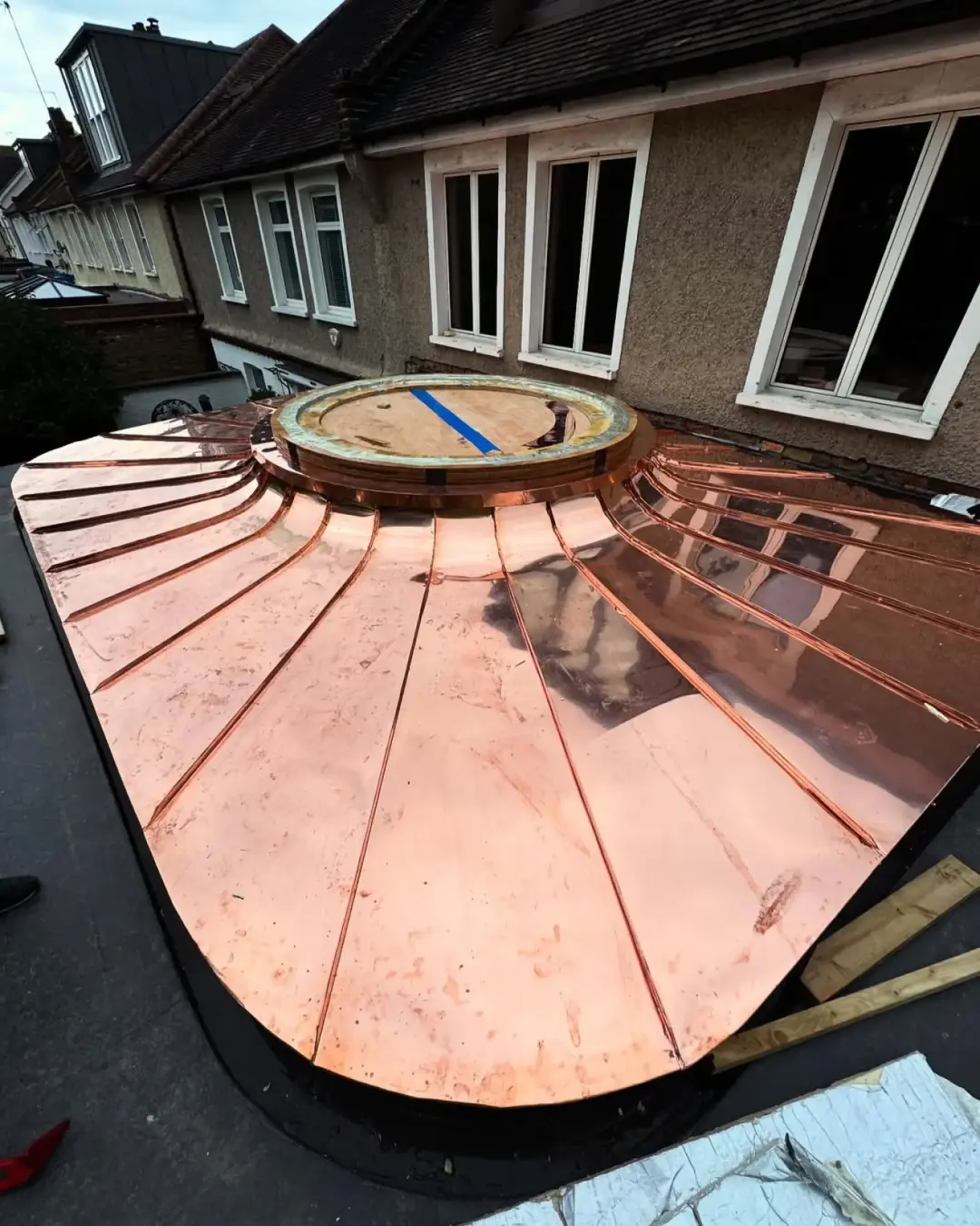 Curved copper standing seam roof around a rooflight in Wandsworth